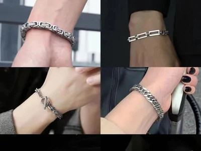 Cuatro muñecas con pulseras de cadena metálica plateada